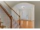 Spacious foyer with hardwood floors, a staircase with carpet, and natural light at 1526 Town Home Dr, Apex, NC 27502