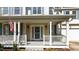 Charming front porch featuring classic white columns and inviting entrance at 1526 Town Home Dr, Apex, NC 27502