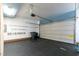Spacious garage with a black floor, gray door, and plenty of storage at 1526 Town Home Dr, Apex, NC 27502