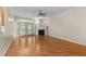 Cozy living room with a fireplace, hardwood floors, and a door to the exterior at 1526 Town Home Dr, Apex, NC 27502