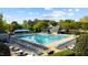Community pool with lounge chairs surrounding it and a shelter at 1526 Town Home Dr, Apex, NC 27502