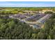 Overhead shot capturing neighborhood homes nestled near tree line, offering privacy and scenic views at 153 Telluride Trl, Garner, NC 27529