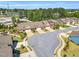 Aerial view of townhomes with manicured lawns and landscaping surrounding the area on a sunny day at 153 Telluride Trl, Garner, NC 27529