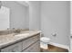 Bathroom with granite vanity, modern fixtures, and neutral paint at 153 Telluride Trl, Garner, NC 27529