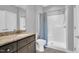 Bathroom features vanity with granite countertop and walk-in shower with curtain at 153 Telluride Trl, Garner, NC 27529