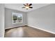 Bedroom with hardwood floors, a ceiling fan and a window with natural light at 153 Telluride Trl, Garner, NC 27529