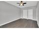 Spacious bedroom with hardwood floors, ceiling fan and neutral paint at 153 Telluride Trl, Garner, NC 27529