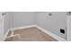 Laundry room with tile flooring and utility sink at 153 Telluride Trl, Garner, NC 27529