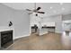 Open concept living room with fireplace and spacious modern kitchen with island at 153 Telluride Trl, Garner, NC 27529