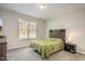 Cozy bedroom with a rustic headboard, soft carpet, and a bright window at 178 Cullen Ct, Clayton, NC 27520