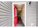 A home entry featuring a red front door at 178 Cullen Ct, Clayton, NC 27520