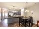 Open-concept kitchen and dining area with stainless steel appliances and granite countertops at 178 Cullen Ct, Clayton, NC 27520