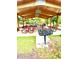 Covered picnic area with red tables and a grill for outdoor gatherings at 178 Cullen Ct, Clayton, NC 27520
