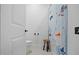Bright bathroom featuring a shower with a playful curtain, toilet, and stool, offering a cheerful space at 188 E Antebellum Dr, Pittsboro, NC 27312