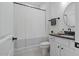 Bright bathroom with a shower and round mirror at 188 E Antebellum Dr, Pittsboro, NC 27312