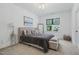 Elegant bedroom featuring a comfortable bed, stylish decor, and a window, creating a serene retreat at 188 E Antebellum Dr, Pittsboro, NC 27312