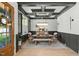 Elegant dining room featuring a coffered ceiling, chandelier, and seating for six at 188 E Antebellum Dr, Pittsboro, NC 27312