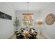 Bright dining nook with a modern light fixture, and view of the garden at 188 E Antebellum Dr, Pittsboro, NC 27312