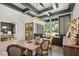 Bright dining area featuring a modern chandelier and view of the backyard at 188 E Antebellum Dr, Pittsboro, NC 27312