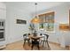 A dining area with a round table and bright natural lighting at 188 E Antebellum Dr, Pittsboro, NC 27312