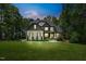 Charming two-story home with a lush green lawn and a welcoming front porch; perfect for relaxing and enjoying the neighborhood views at 188 E Antebellum Dr, Pittsboro, NC 27312