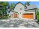 The home has 2 garages, a basketball hoop and well manicured landscaping at 188 E Antebellum Dr, Pittsboro, NC 27312