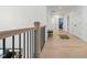 Hallway boasting light wood floors, white walls, and a bench, blending clean lines with comfort at 188 E Antebellum Dr, Pittsboro, NC 27312