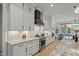 Stylish kitchen features white cabinets, granite countertops, and a stainless steel range at 188 E Antebellum Dr, Pittsboro, NC 27312