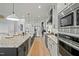This open kitchen has granite countertops, and stainless steel appliances with plenty of room to entertain at 188 E Antebellum Dr, Pittsboro, NC 27312