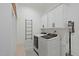 Well-organized laundry room with modern washer and dryer at 188 E Antebellum Dr, Pittsboro, NC 27312