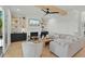 Comfortable living room with a fireplace, floating shelves, and sectional sofa at 188 E Antebellum Dr, Pittsboro, NC 27312