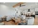 Spacious living room adjacent to kitchen features contemporary decor and ample seating at 188 E Antebellum Dr, Pittsboro, NC 27312