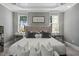 A serene main bedroom has tray ceilings and beautiful natural lighting at 188 E Antebellum Dr, Pittsboro, NC 27312