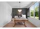 A home office with decorative chandelier and bright natural lighting at 188 E Antebellum Dr, Pittsboro, NC 27312