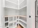Walk-in pantry with open shelving and convenient storage solutions for an organized kitchen at 188 E Antebellum Dr, Pittsboro, NC 27312