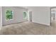 Neutral bedroom with carpet flooring and natural light from two large windows at 201 Benton Dr, Oxford, NC 27565