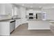 Well-equipped kitchen features white cabinetry, a kitchen island and stainless steel appliances at 201 Benton Dr, Oxford, NC 27565