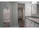 Well-lit bathroom boasting granite counters, modern cabinets, and a walk in closet at 206 Rochelle Dr, Knightdale, NC 27545