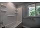 Bathroom featuring a tub/shower combo and a view from the window at 206 Rochelle Dr, Knightdale, NC 27545