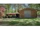 Charming brick home featuring mature landscaping and a classic mid-century modern design at 206 Rochelle Dr, Knightdale, NC 27545