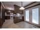 Kitchen with oak cabinetry, French doors, and granite countertops at 206 Rochelle Dr, Knightdale, NC 27545