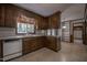 Kitchen featuring wood cabinets, laminate countertops and tile flooring at 206 Rochelle Dr, Knightdale, NC 27545