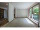 Bright living room with large picture windows offering beautiful views of the surrounding nature at 206 Rochelle Dr, Knightdale, NC 27545