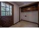 Mud room features wooden cabinets for storage and a door with view of outdoor greenery at 206 Rochelle Dr, Knightdale, NC 27545
