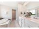 Luxurious bathroom with double vanity, soaking tub, and marble flooring at 21 Green Links Dr, Cameron, NC 28326