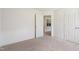Cozy bedroom with carpet, white walls, and doors leading to other rooms at 21 Green Links Dr, Cameron, NC 28326