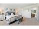 Bright bedroom features stylish decor, a comfortable bed, and an inviting, neutral color palette at 21 Green Links Dr, Cameron, NC 28326