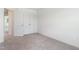 Empty bedroom featuring a closet and carpeted floors at 21 Green Links Dr, Cameron, NC 28326