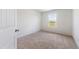 Bright bedroom featuring a window with a view of the neighborhood and carpeted floors at 21 Green Links Dr, Cameron, NC 28326
