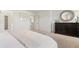 Bright bedroom featuring a dresser, carpeted floor, and access to the bathroom and walk-in closet at 21 Green Links Dr, Cameron, NC 28326